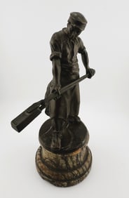 Patinated Bronze figure Metal worker on tinted alabaster base