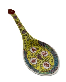 A Chinese Yellow Ground Famille Rose Soup Spoon