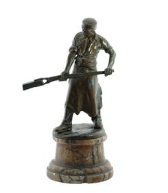 Patinated Bronze figure Metal worker on tinted alabaster base