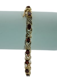 10Kt Baith Yellow Gold Red Topaz Tennis Bracelet.