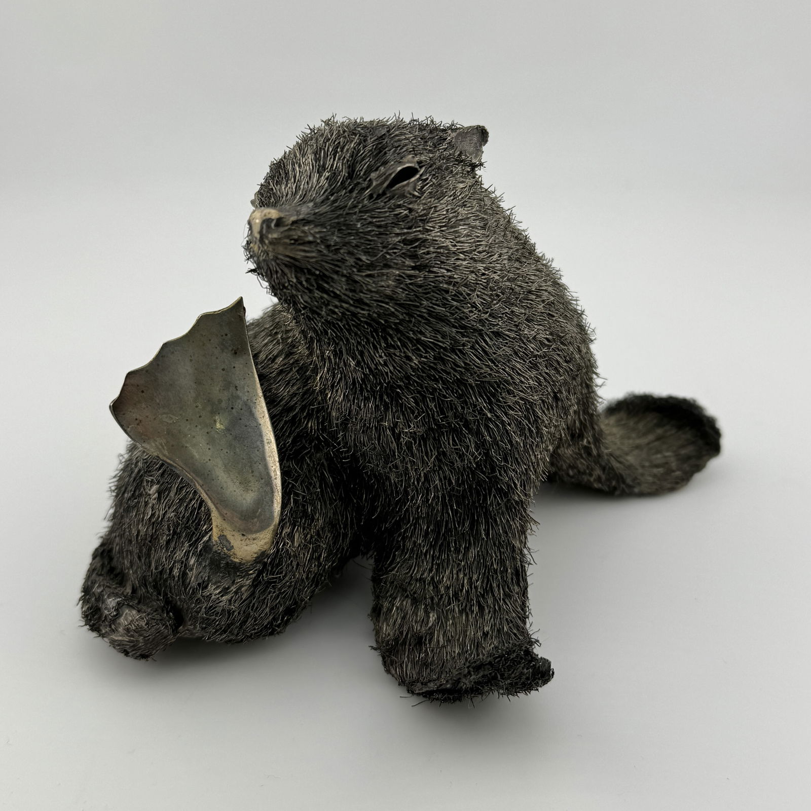 A BUCCELLATI ITALIAN SILVER FIGURE OF A SEAL (1 of 4)