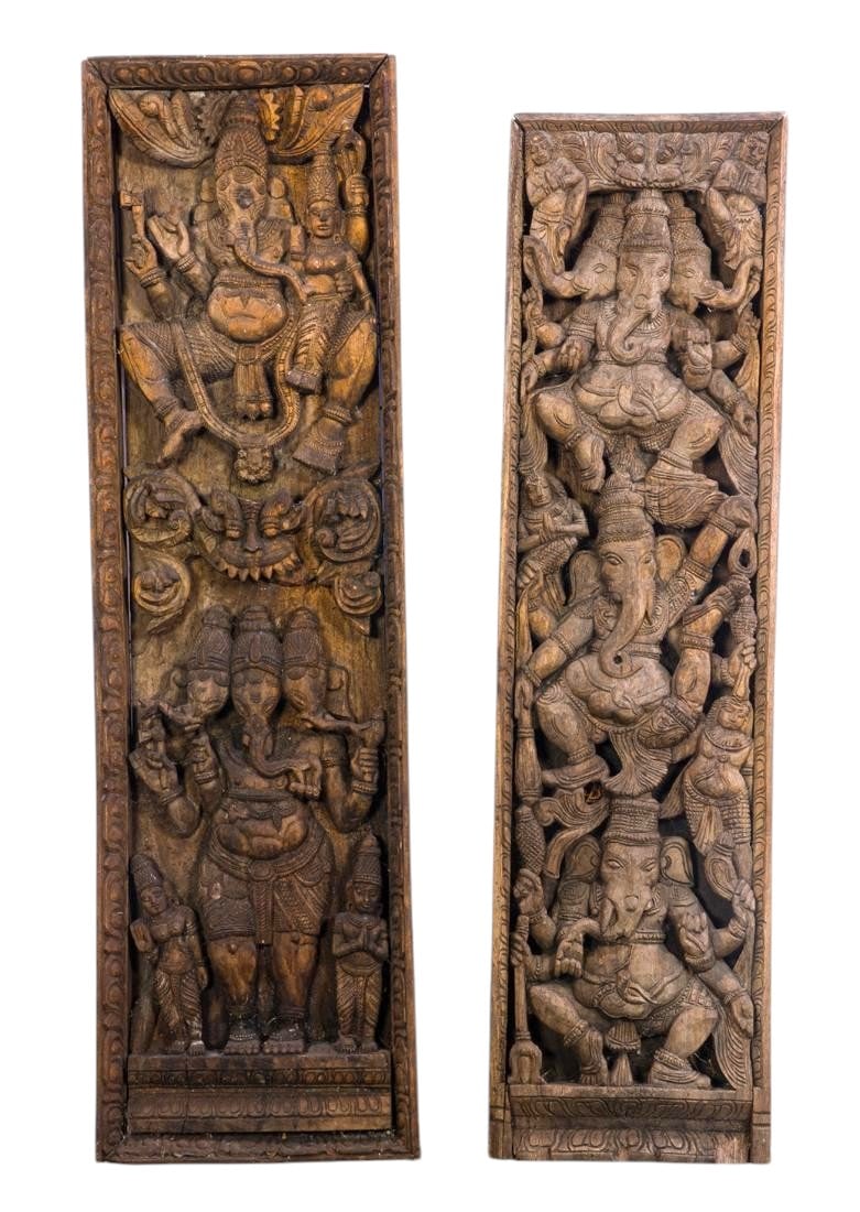 (lot of 2) South Asian wood carvings of Ganesh: (lot of 2) South Asian wood carvings of Ganesh, carved in deep relief within lotus borders, 44"h. 12.5"w. and 42"h. x 11"w.