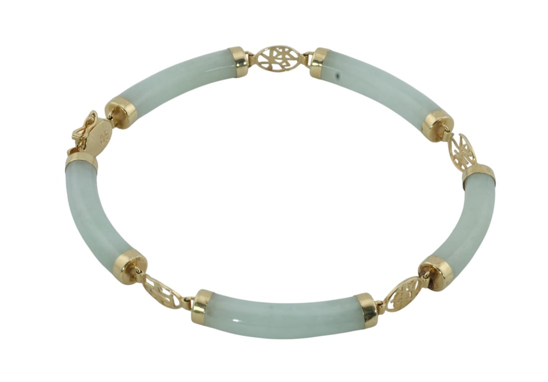14Kt Gold Green Jade Bracelet: 14K Gold Green Jade Bracelet. Length 7 1/2" weight 10.2 grams