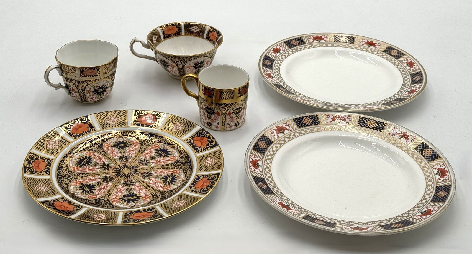 Group of Royal Crown Derby Dinnerware: Group of Royal Crown Derby Dinnerware. Total 6 pieces, 3 plates and 3 cups. Largest plate diameter 8.5" J/M