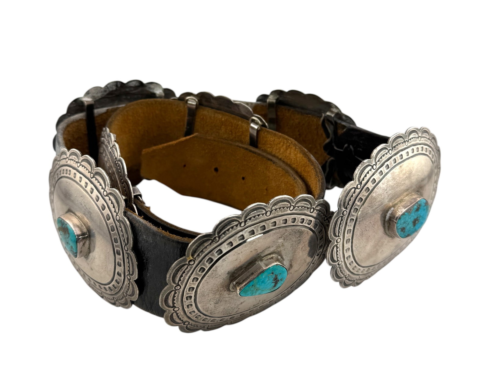 Vintage Native American Turquoise and Sterling Silver Concho Belt.: Vintage Native American Turquoise and Sterling Silver Concho Belt. The Belt has seven oval conchos each with turquoise stones resting in bezels. Belt is 40" Long and weight 614 grams. T/S