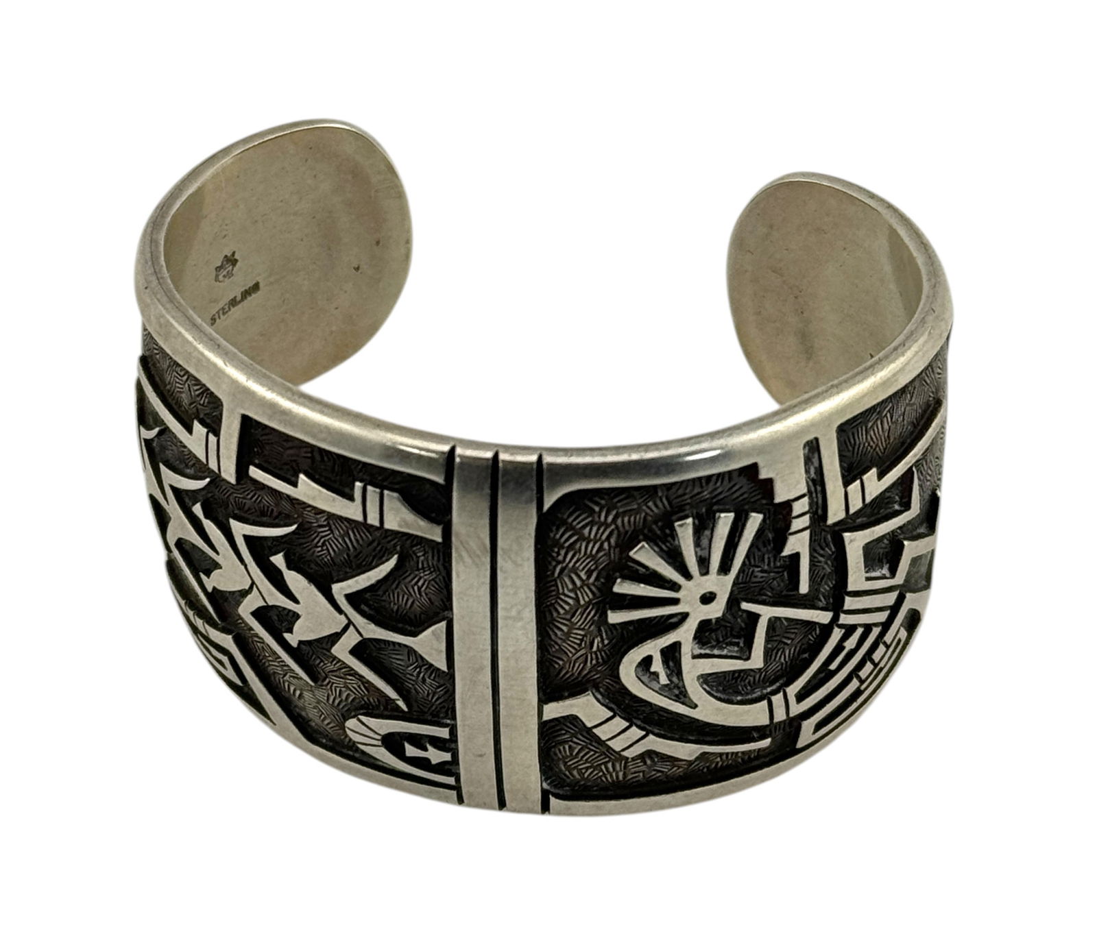 Native American Sterling Silver Cuff Bracelet featuring Kokopelli: Native American Sterling Silver Bracelet featuring Kokopelli. Marked "Sterling and Star symbol." Size 6.5 inches and weight 82 grams. T/S