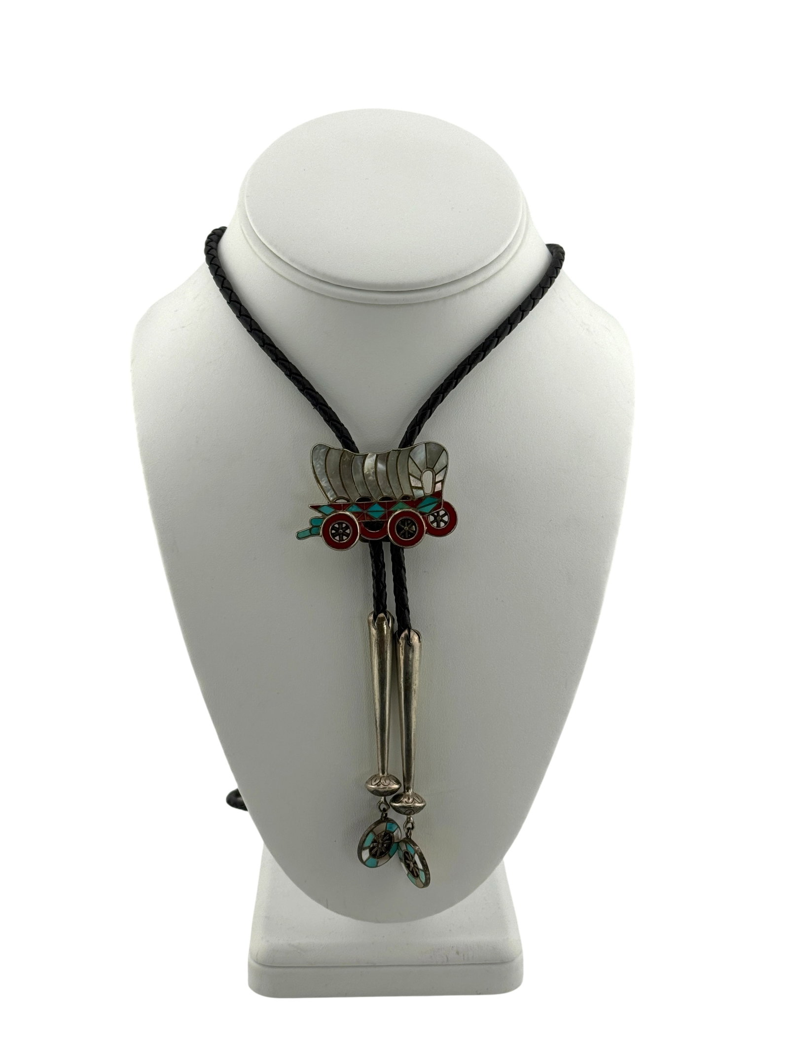 Vintage Zuni Sterling Silver Turquoise and Mother of Pearl Inlay Wagon Bolo Tie: Vintage Zuni Sterling Silver Turquoise and Mother of Pearl Inlay Wagon Bolo Tie. Stamped "Sterling on back of bolo. Total length of tie is 42." Bolo slide measures 1.75" x 1.25." Total weight with tie