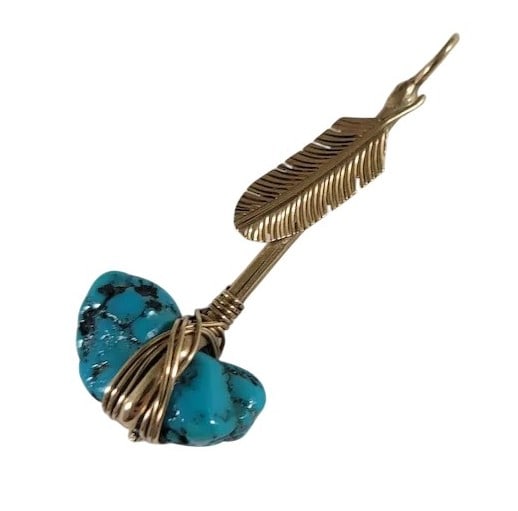 Navajo T. Bedah Signed 14K Gold Turquoise Tomahawk Pendant: Native American pendant is signed T. Bedah for Navajo artist Tim Bedah. It is also marked 14k. The pendant is a tomahawk with a feather and a turquoise nugget. This pendant measures approximately 2