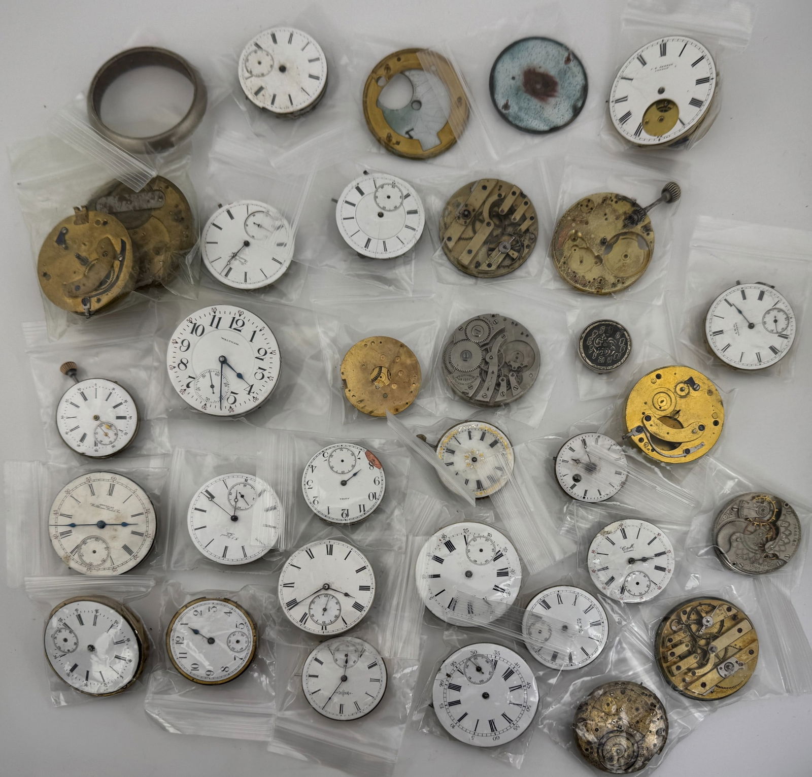 Large Collection of Pocket Watch Parts including Movements and Dials (1 of 2)