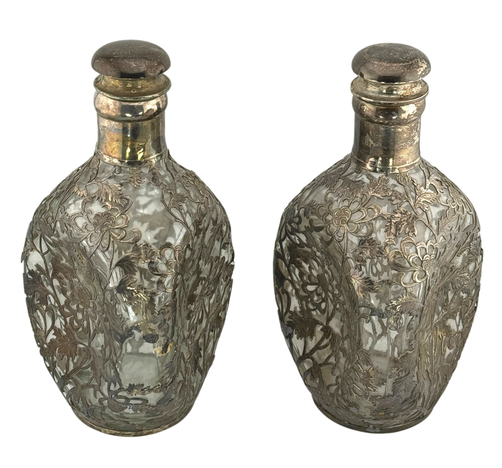 Pair of HAIG Sterling Silver Overlay Leaf Pattern Glass Decanter: Pair of HAIG Sterling Silver Overlay Leaf Pattern Glass Decanter. Marked "935 Sterling" and Chinese character on the underside. Condition: Missing cork on one decanter, some loss on silver floral