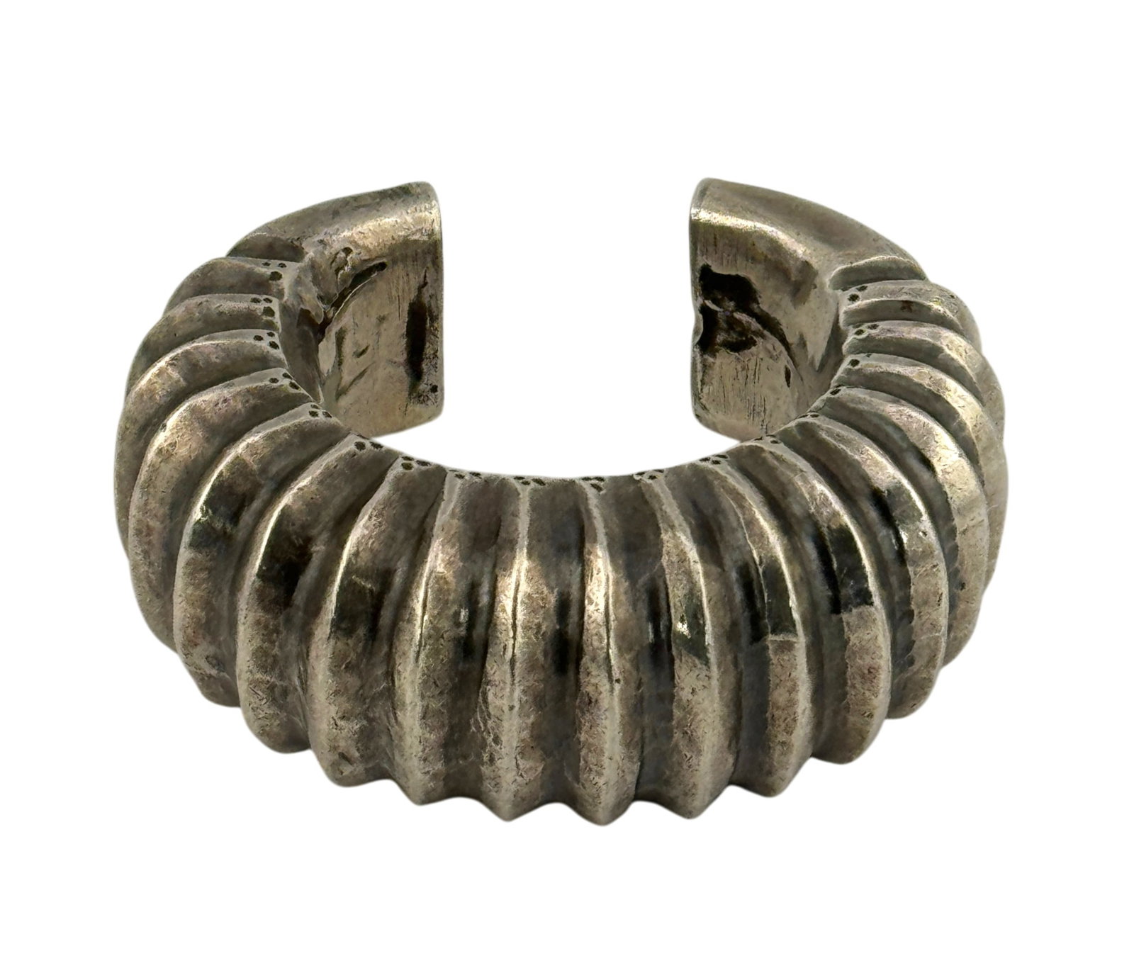 1920s North Indian Gujarati Ridges 800 Silver Cuff Bracelet: 1920s North Indian Gujarati Ridges 800 Silver Cuff Bracelet. Designed with high grooved ridges and engraved geometric pattern detail. Unmarked but XRF scanned for 800 silver. Condition: dents and
