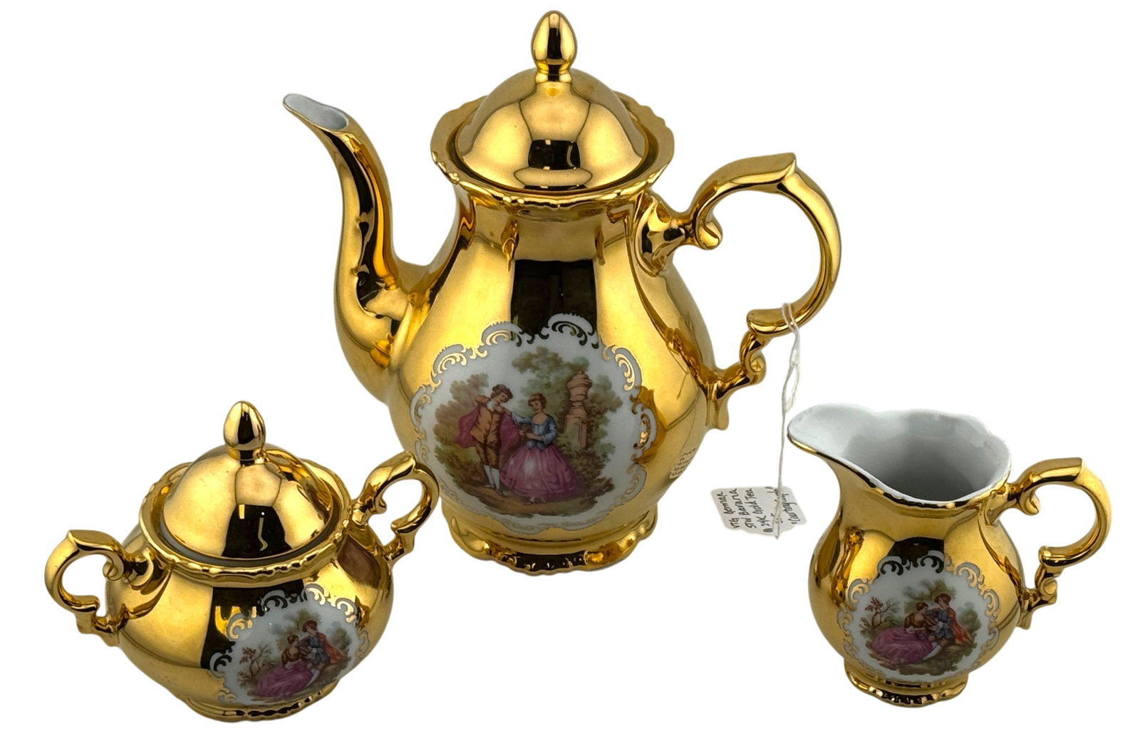 Vintage STW Bavaria 24K Gold Tea Set: Vintage STW Bavaria German 24K "Courting Couple" Tea Set. Excellent condition. Teapot: 7.5" x 6.5" x 4", Sugar: 4.25" x 5"x 3.75 Creamer: 3.5" x 3.5" x 2.5". A/R