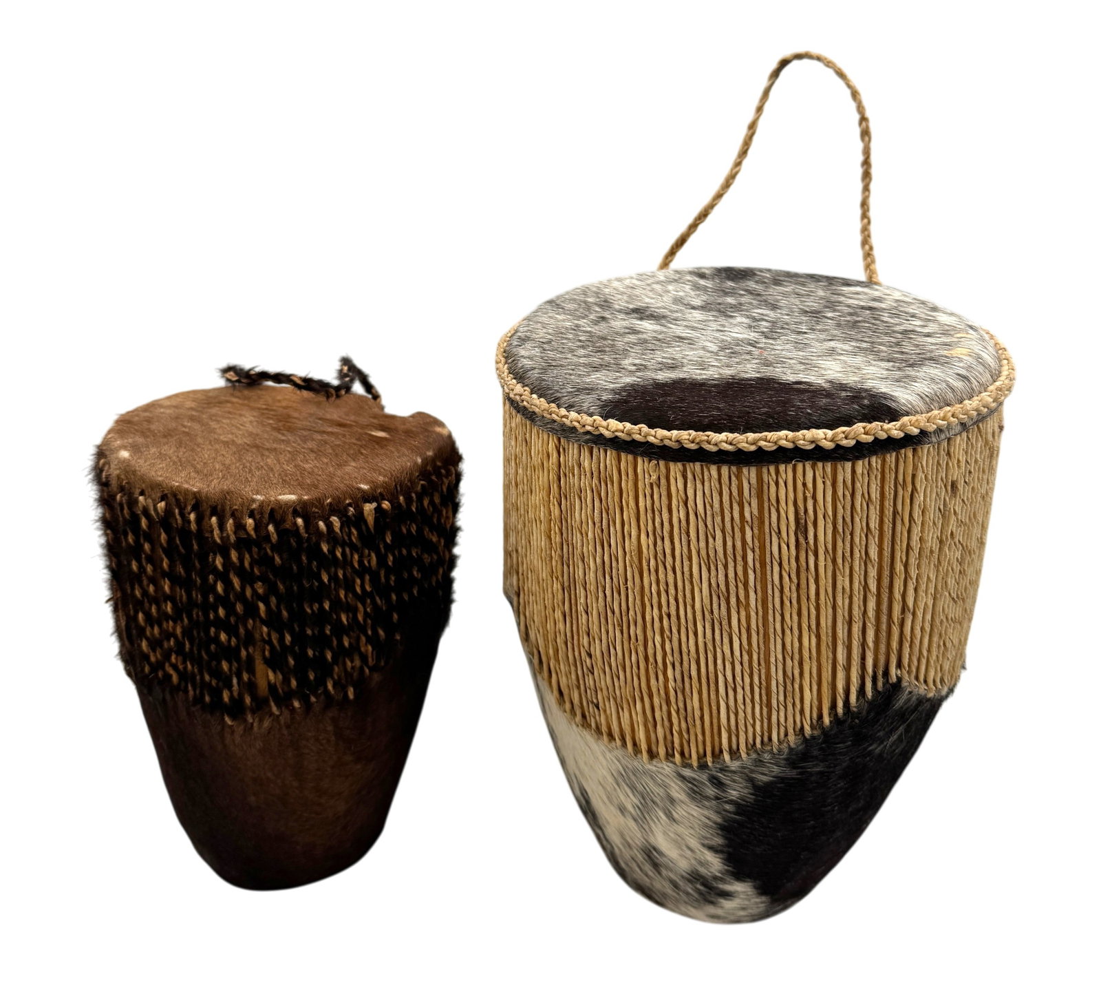 Ugandan Tribal Drums: Pair of Ugandan tribal hand drums, made from cowhide and hardwood. Very good condition. Dimensions: Approx 9"h x 7"d and 7.5"h x 5"d A/R