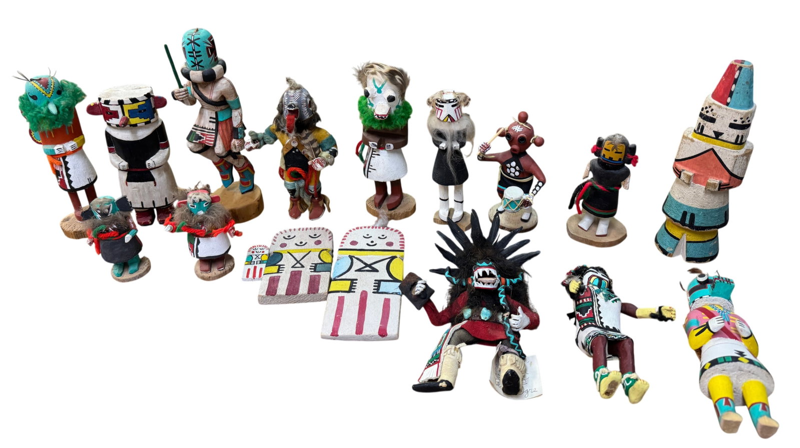 (Lot of 17) Native American Indian Hopi & Navajo Kachinas: (Lot of 17) Native American Indian Hopi & Navajo Kachinas. Largest dimension: 8.5" x 2.5" x 2.5" Condition: Some kachinas have losses. As is.