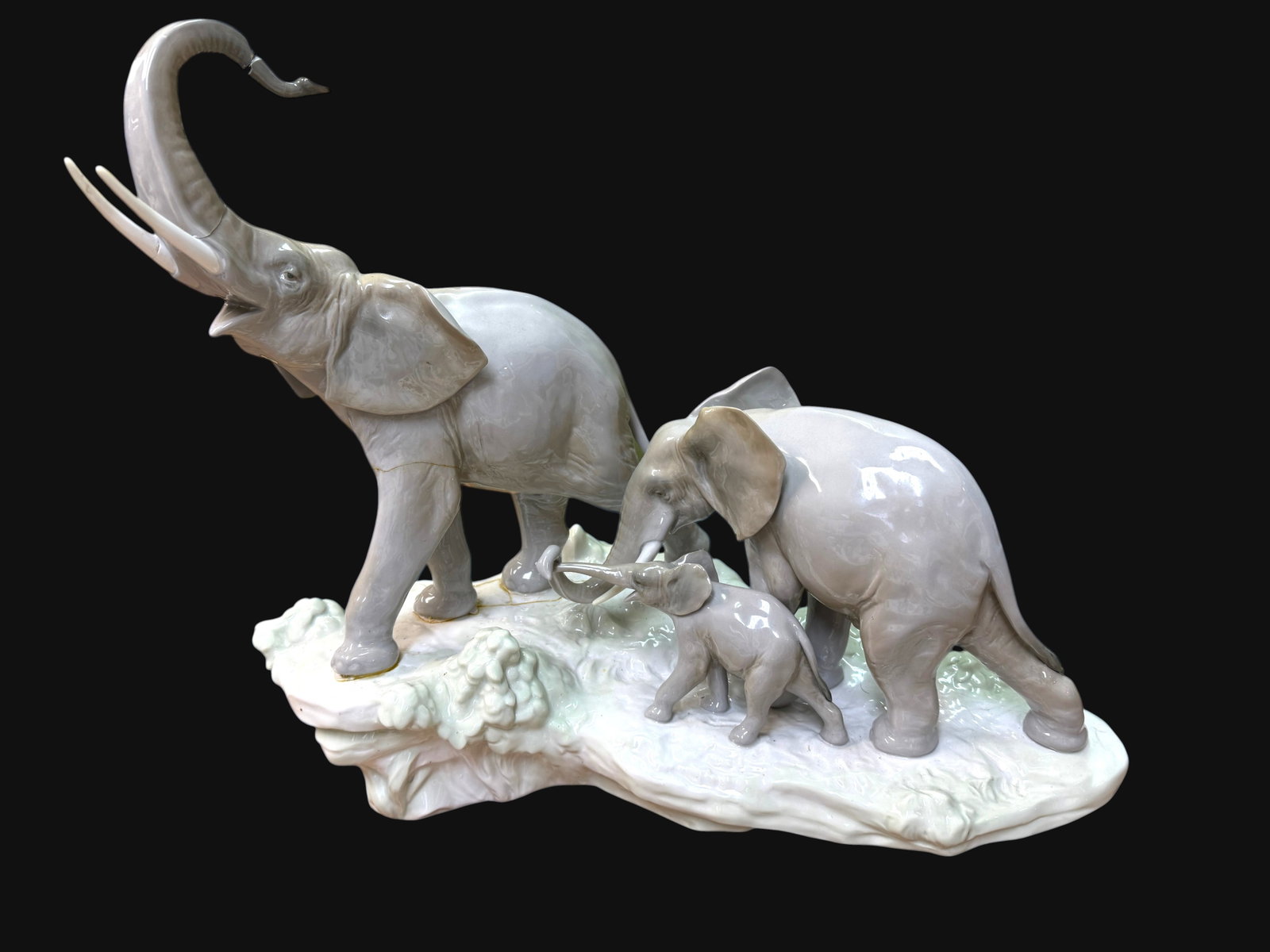 Lladro Walking with Elephants Style 1150 Gloss Sculpture: Lladro Walking with Elephants Style 1150 Gloss Sculpture. Condition: Major repairs and loss around trunk, legs, and base. Dimension 14.5" x 8" x 15" J/M