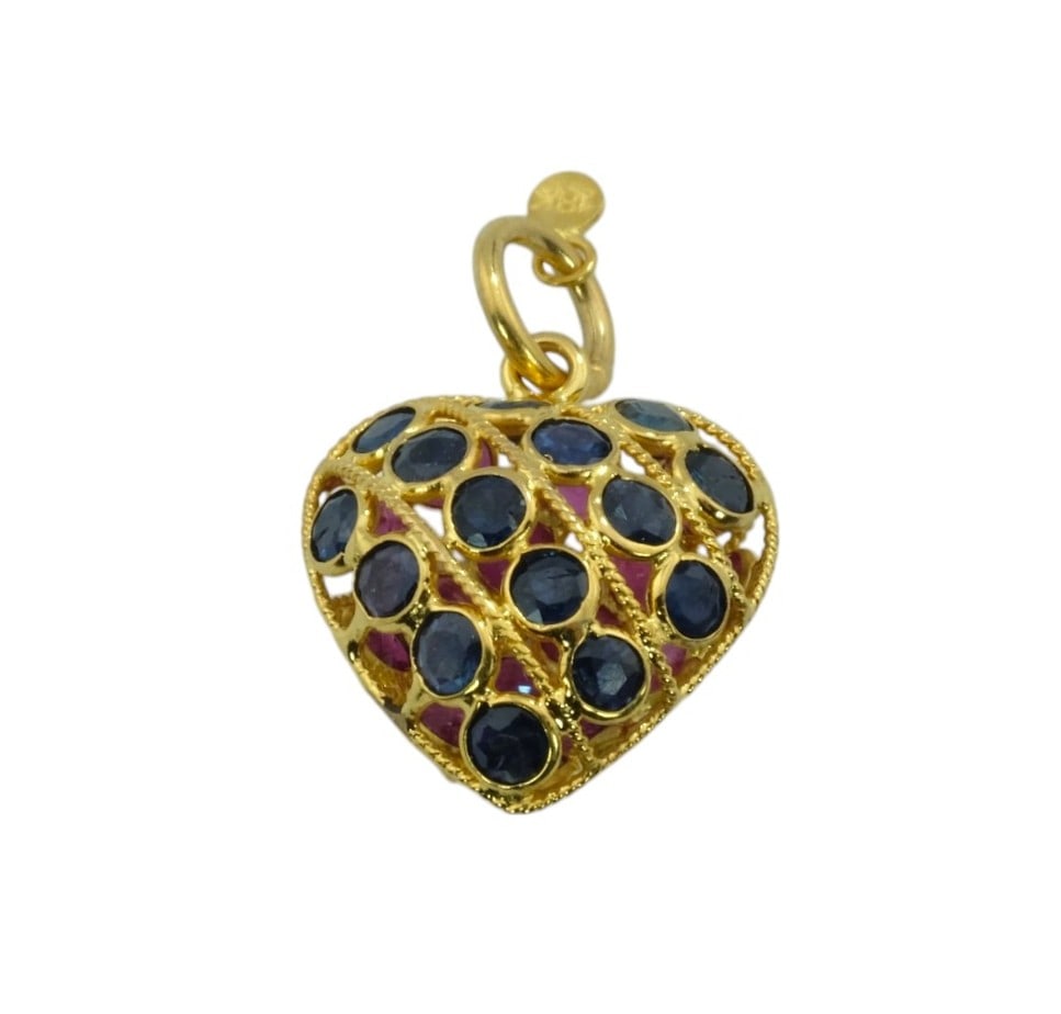 18Kt Yellow Gold Double sided Ruby and Sapphire Puffy Heart Charm: 18Kt Yellow Gold Double sided Ruby and Sapphire Puffy Heart Charm. Weight 0.9 grams