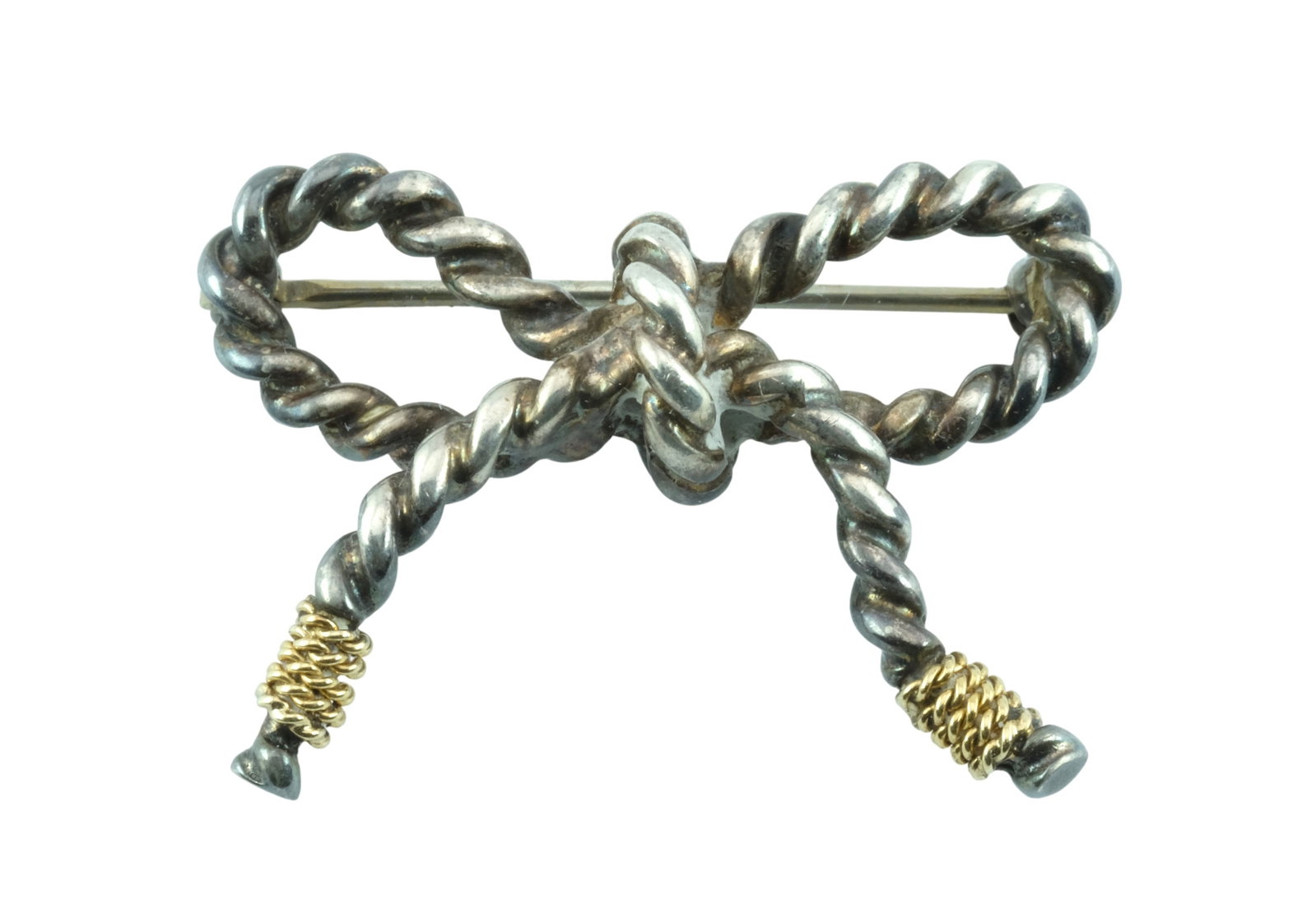 Tiffany & Co Vintage Two-Tone Sterling 18Kt Rope Bow Brooch: Tiffany & Co Gold, Silver Rope Bow Pin, Brooch. Tied rope bow. Sterling silver and 18K gold. Hallmarked on back. 1.25 inches.