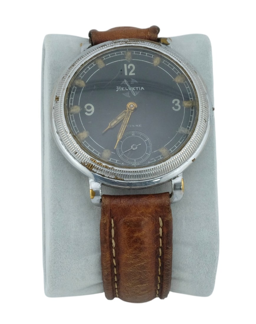 1940S German Helvetia Jumbo WWII Pilot Watch: 1940S German Helvetia Jumbo WWII Pilot Watch. Condition: Untested, missing crown. CV Auction does not guarantee working condition, time keeping accuracy or original components as repairs may have