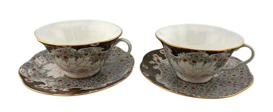 Wedgwood Daisy Tea Story Teacup & Saucer Pair: Set of two Wedgwood Daisy Tea Story Teacup and Saucers new in original gift box. Dimensions: 8" diameter x 6" tall each.