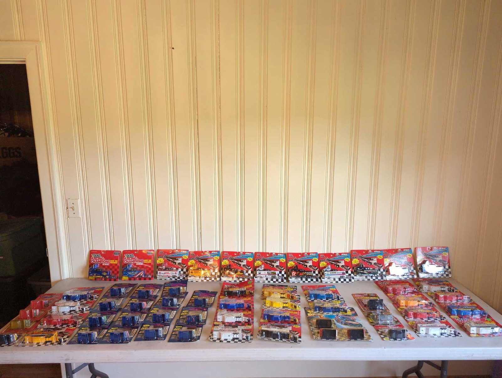 Over 50 NASCAR Racing Champions Die Casts: Several NASCAR die cast cars and team transporters, see photos for all included.
