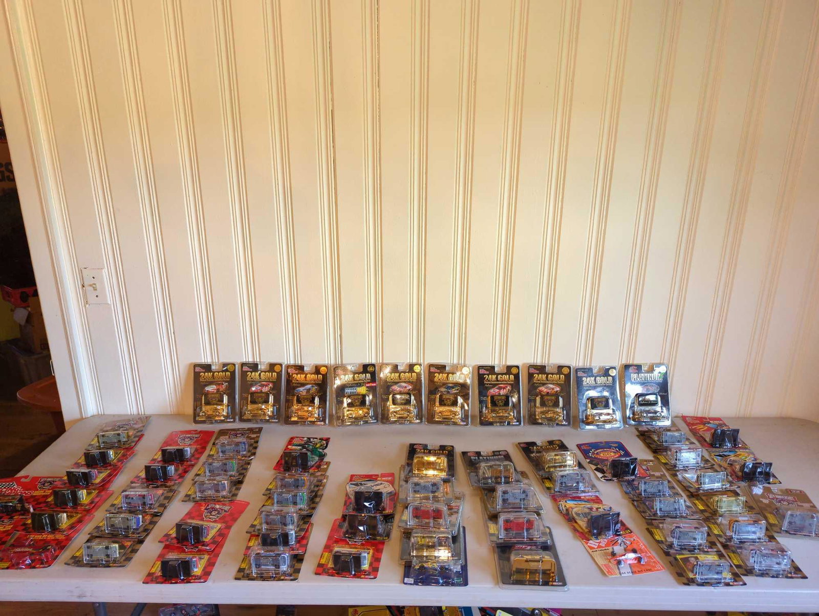 Over 60 NASCAR Racing Champions 24K Gold Plated Series cars & die cast cars & transporters: Several NASCAR die cast cars, team transporters and 24K Gold Plated Commemorative Series cars, see photos for all included.