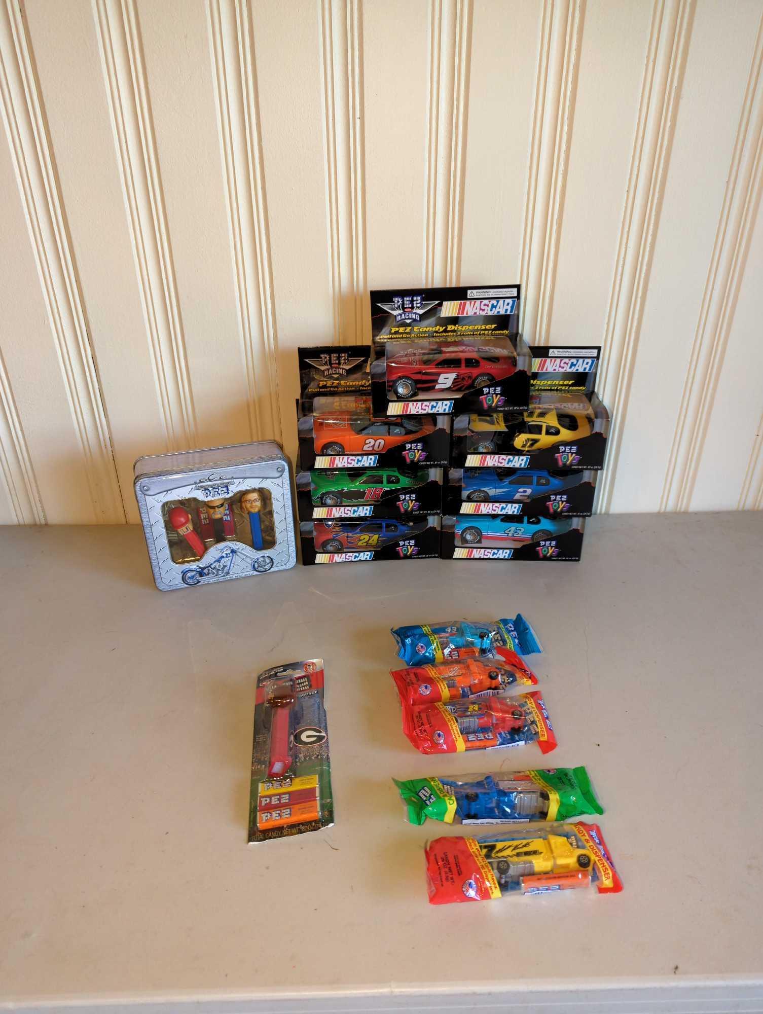 Group of PEZ Items: Several PEZ dispensers including NASCAR cars, see photos for all included.