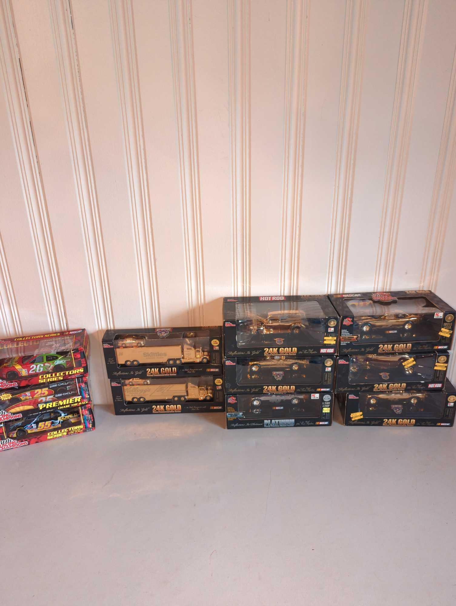 Great Selection of Racing Champions 1:24 and 1:64 Scale Die Cast Cars with 24K Gold Collection: Racing Champions NASCAR 1:24 and 1:64 Scale Die Cast Cars including 24K Gold Collection, see photos.