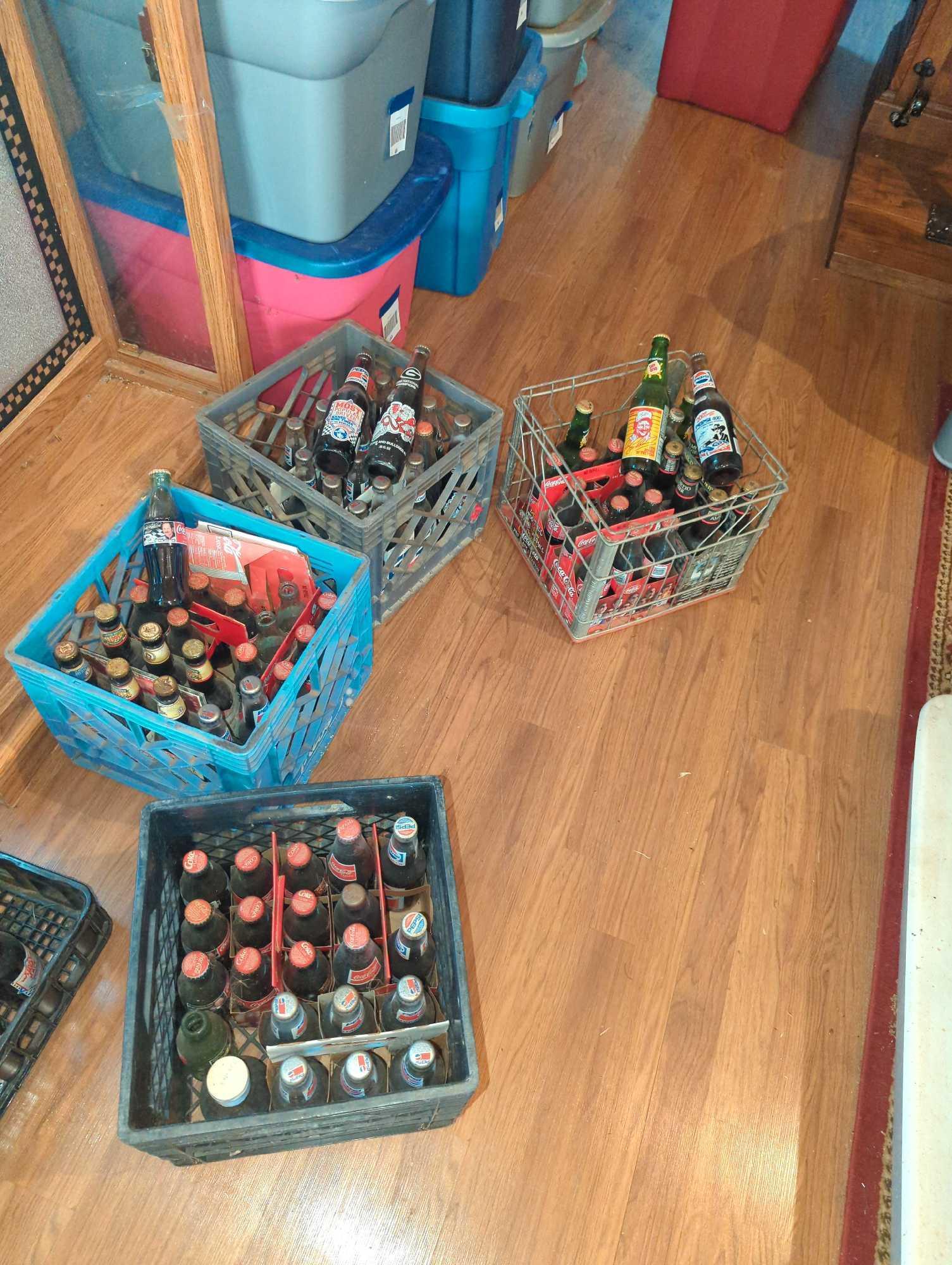 Coca Cola Bottles: Most are unopened and full of cola, with NASCAR design.