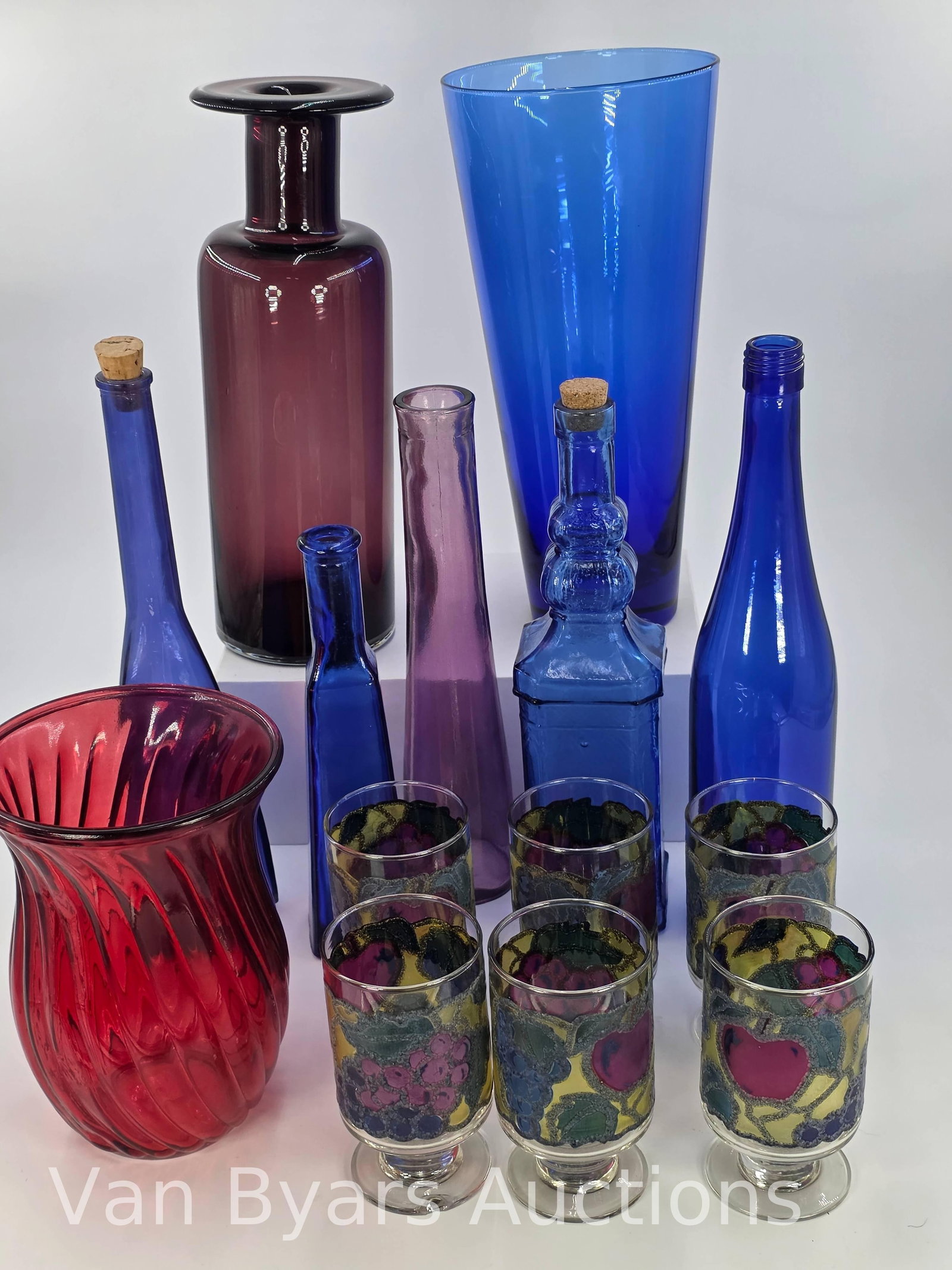 14 Assorted decorative glass Items, INV. 2010: 12 1/2" height of tallest cobalt blue vase. 5" height of drinking glass.