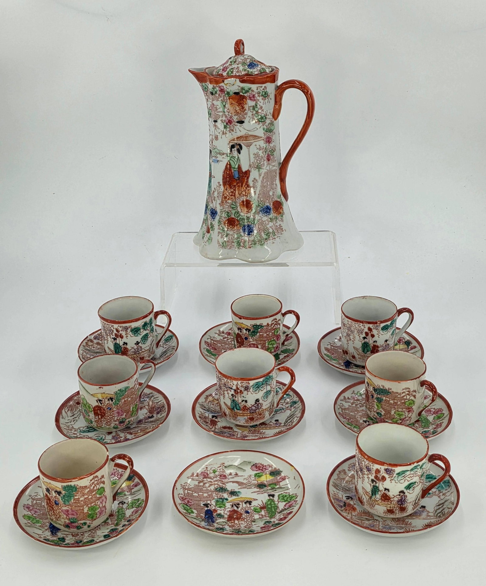 Japanese Chocolate Set with Pot, Plates and Cups, INV. 1085: Repair damage to some cups, small chip to plate. Approx. plate dia. 4 3/8", approx. pot 9 1/4" height.? Pot and some plates with marking.