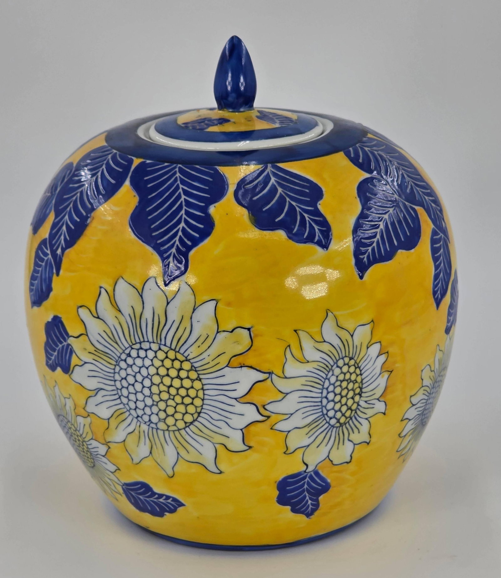 Chinese Porcelain Ginger Jar, INV. 1063: Yellow and blue floral design. Approx. 10" height to top of lid. With marking.