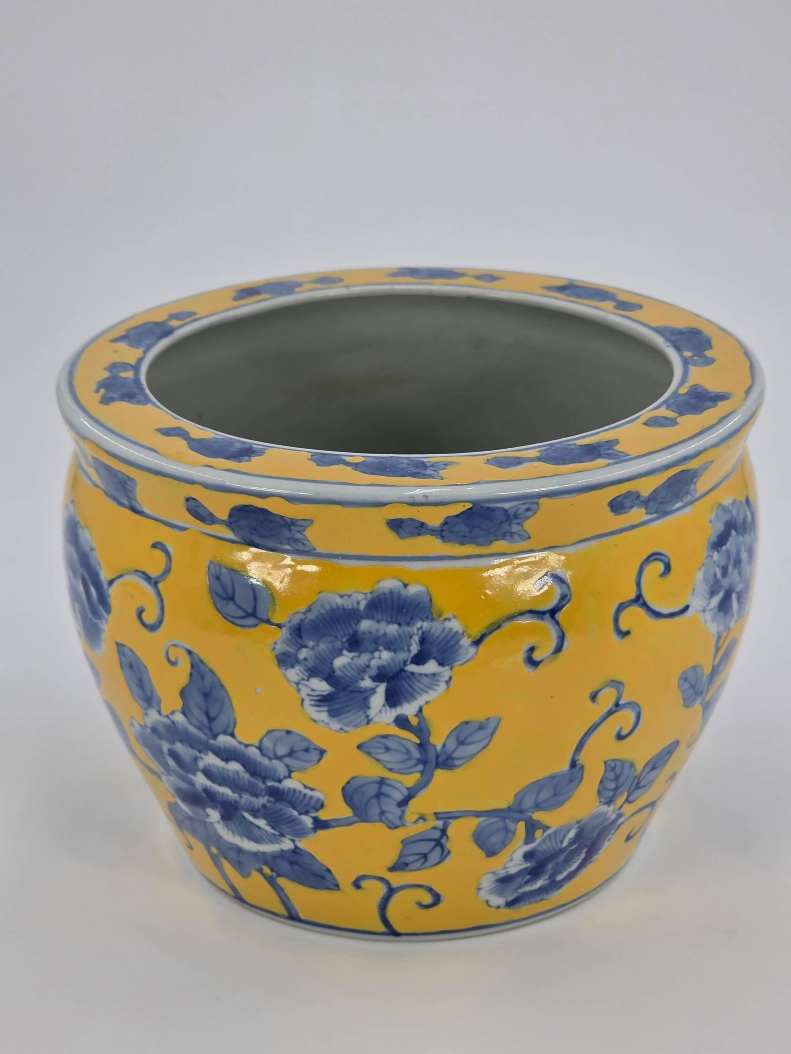 Chinese Porcelain Fish Bowl, INV. 1061: Yellow and blue floral design. 6" height, 8 1/8" diameter.