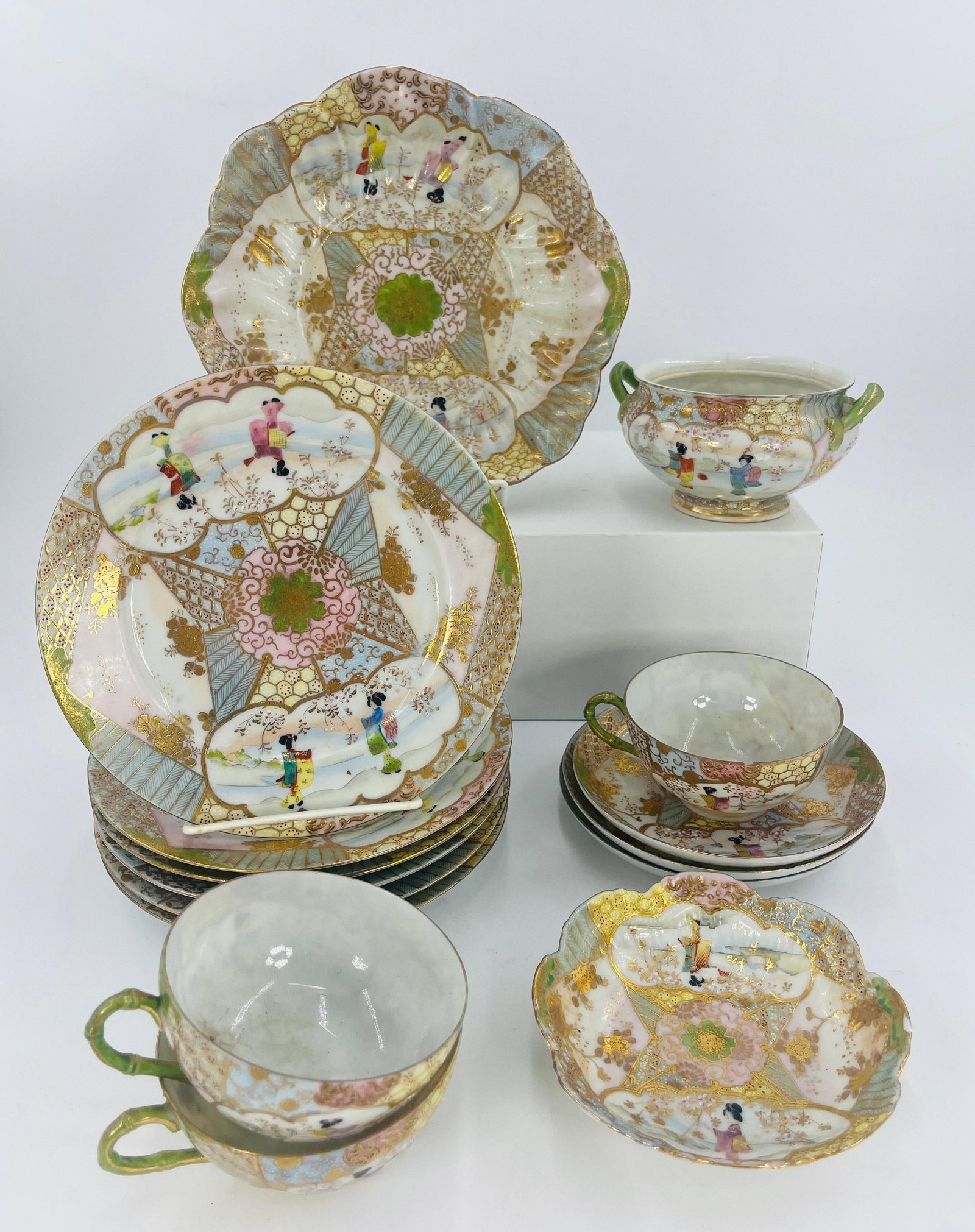 Japanese Kutani or Satsuma Geisha Scene Servingware, INV. 1128: Geisha design. Approx. dia. of widest item 8 3/4". Largest item with marking, 2 with stamp.