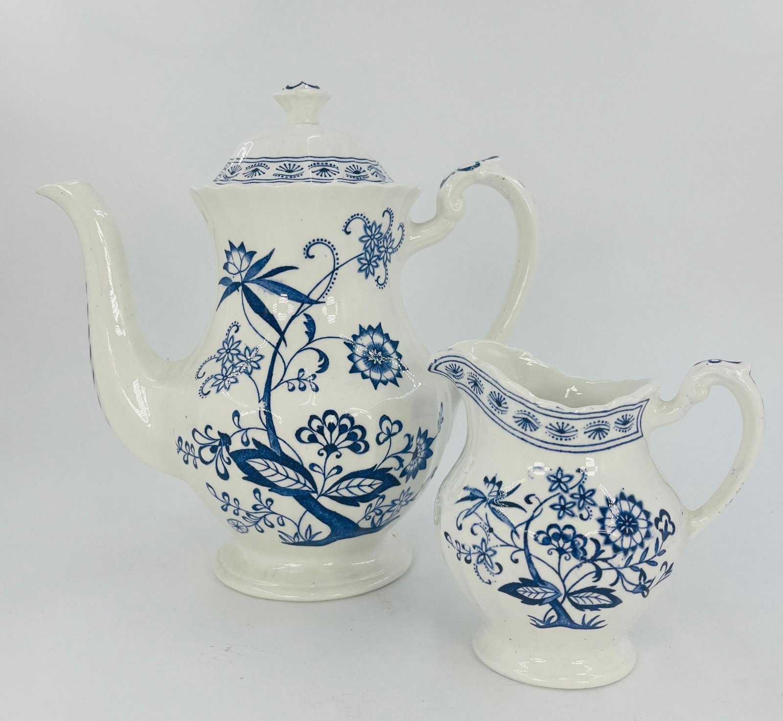 J&G Meakin Classic White and Blue Nordic Coffee Pot and Creamer, INV. 1151: Blue Onion floral pattern. Approx. height 9" to top of lid. With marking.
