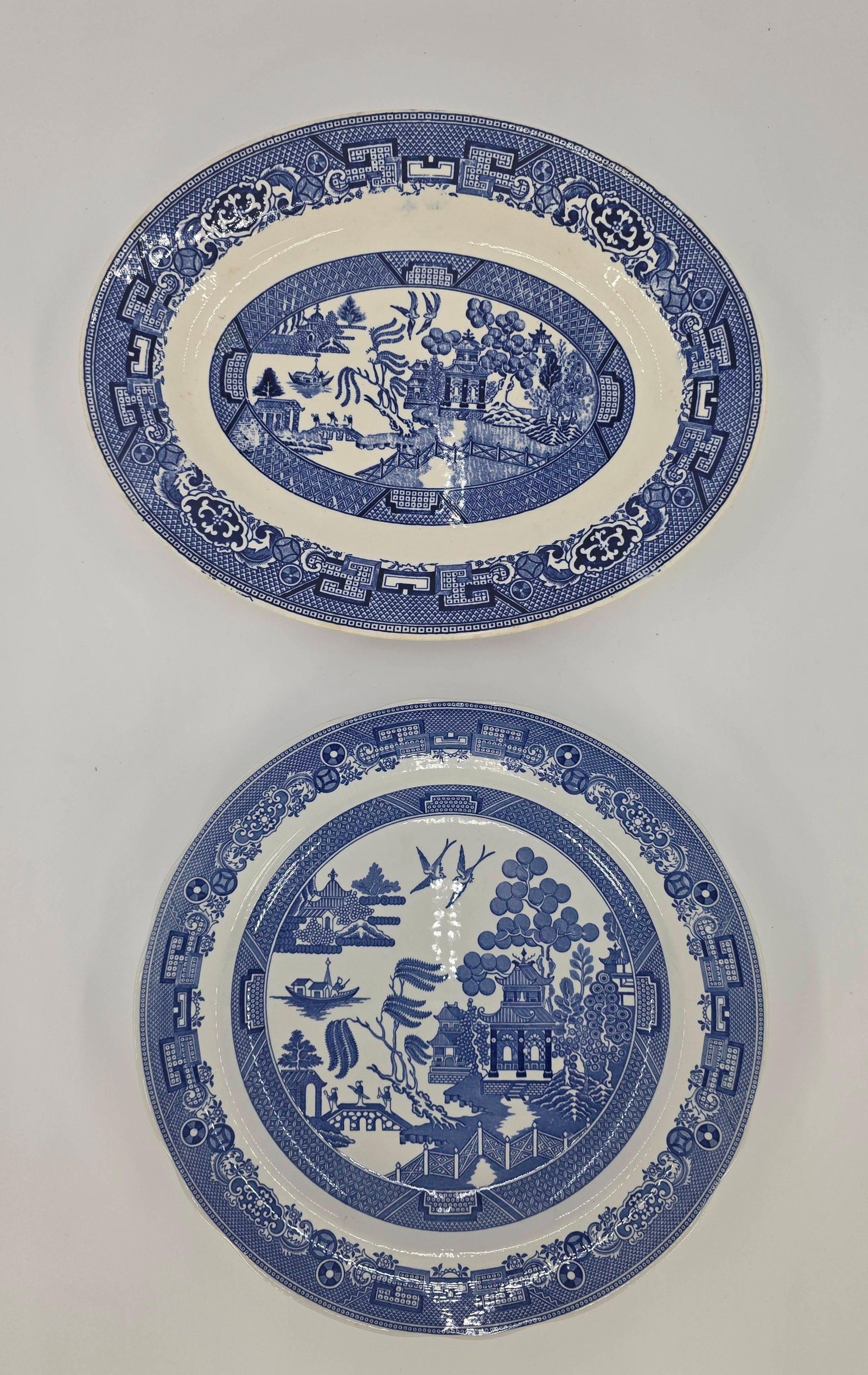 Blue Willow Plate and Platter including Spode and Homer Laughlin, INV. 1032: 10 3/8" dia. The Spode Blue Room Collection "Willow" plate. 11 5/8" dia. Homer Laughlin platter. With markings.
