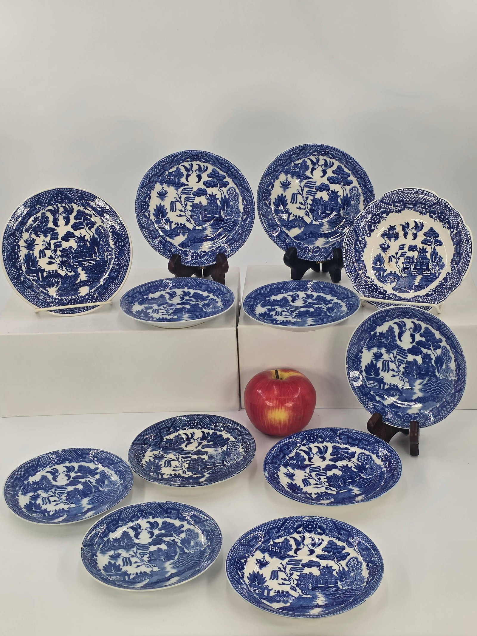 Japanese Blue Willow Pattern Dishes, INV. 1031: Including 10 saucers, 1 small bowl, and 1 small plate. 5 3/4" dia of largest saucer. With markings.