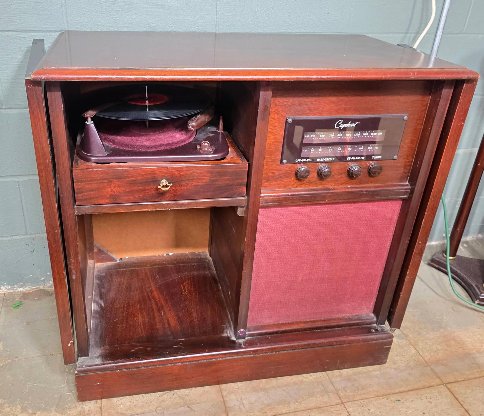 Mahogany Caphart Radio Cabinet with Turn Table, INV. 3014: Model B1003M. Not tested, original cord deteriorating.? Approx. 33 x 34 x 18 inches.