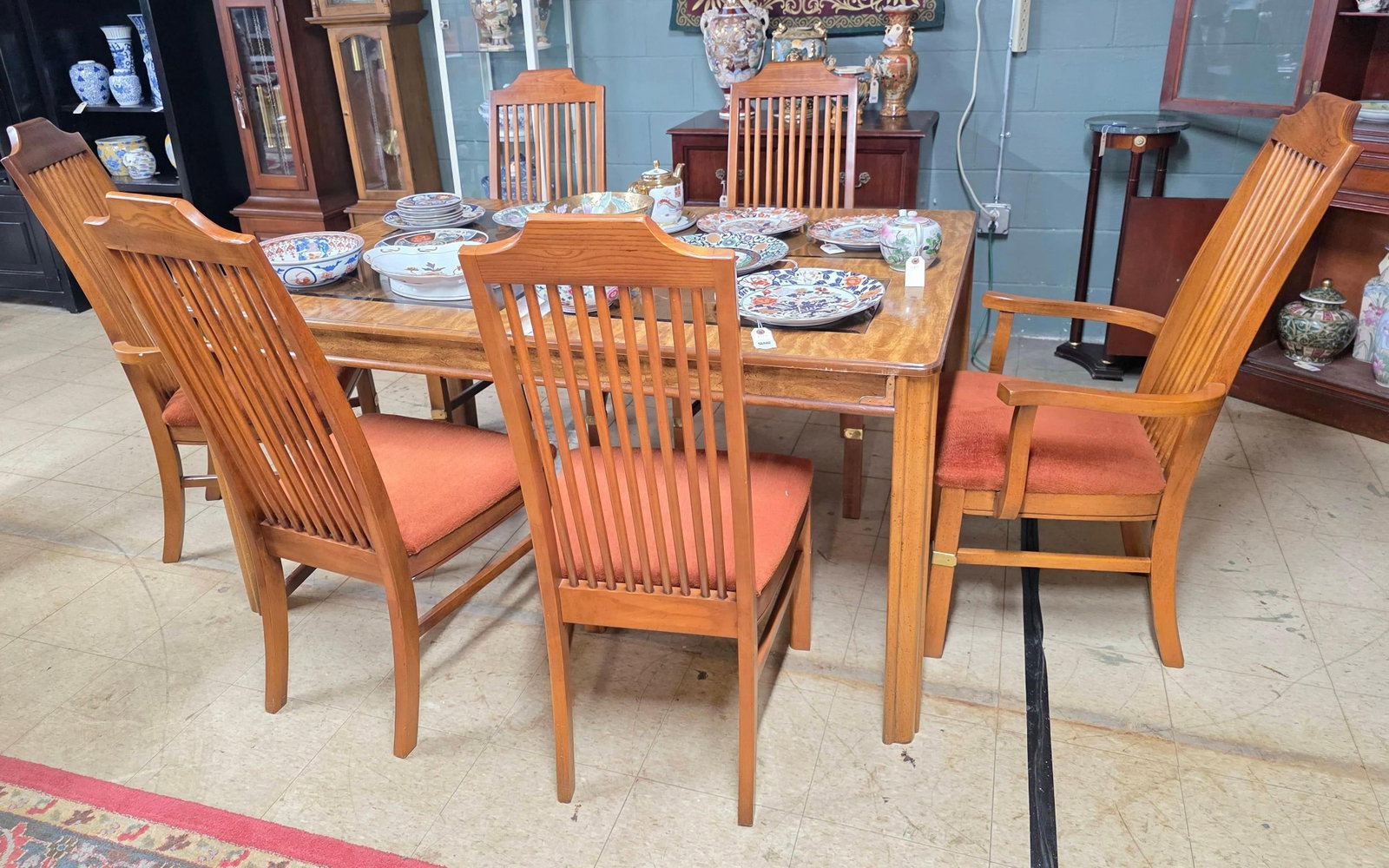 Table with Six Chairs, with Four Glass Panels, INV. 3020: Not including contents. Each chair approx. 43 x 23 x 19 inches. Table approx. 30 x 41 x 61 inches.