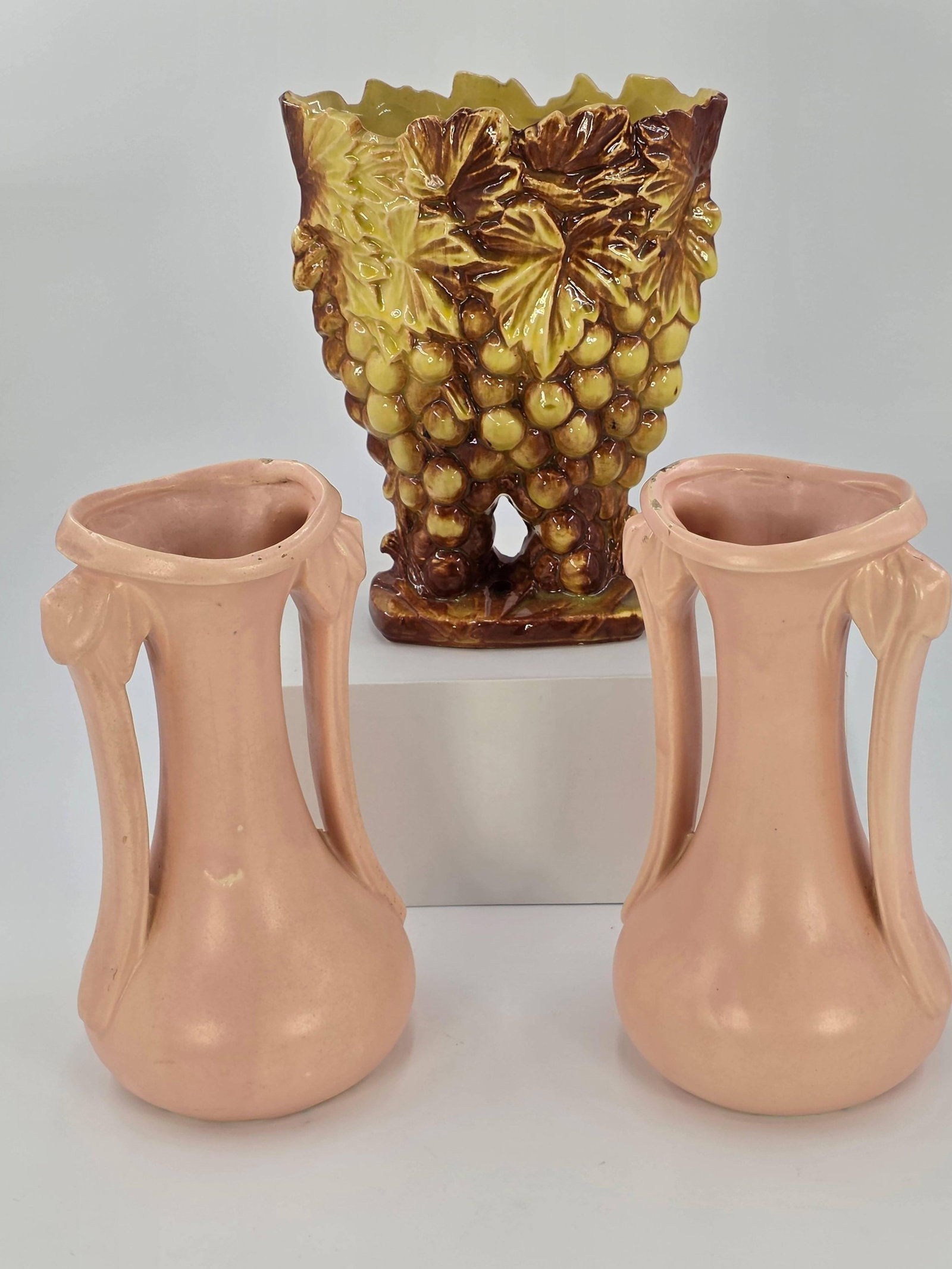 3 McCoy Vases, INV. 1041: 9 1/2" height of pink vase. Pink vases with wear near rim.
