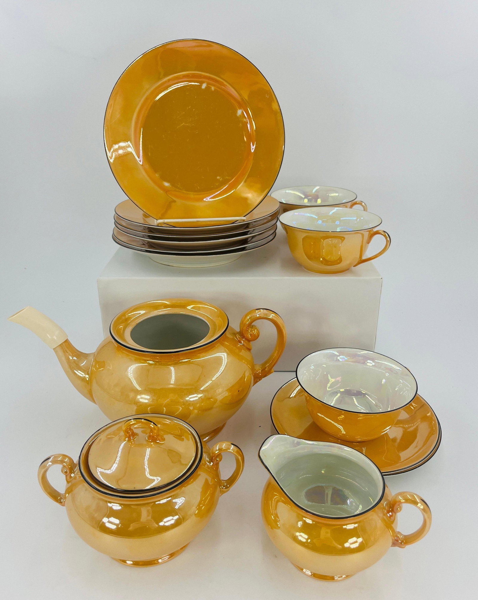 Lusterware, Peach or Orange, Vintage, INV. 1130: Includes 6 plates, 2 saucers, 3 cups, 1 sugar bowl with lid, 1 creamer, 1 tea kettle. Approx. dia. of plate 7 1/8". With marking.