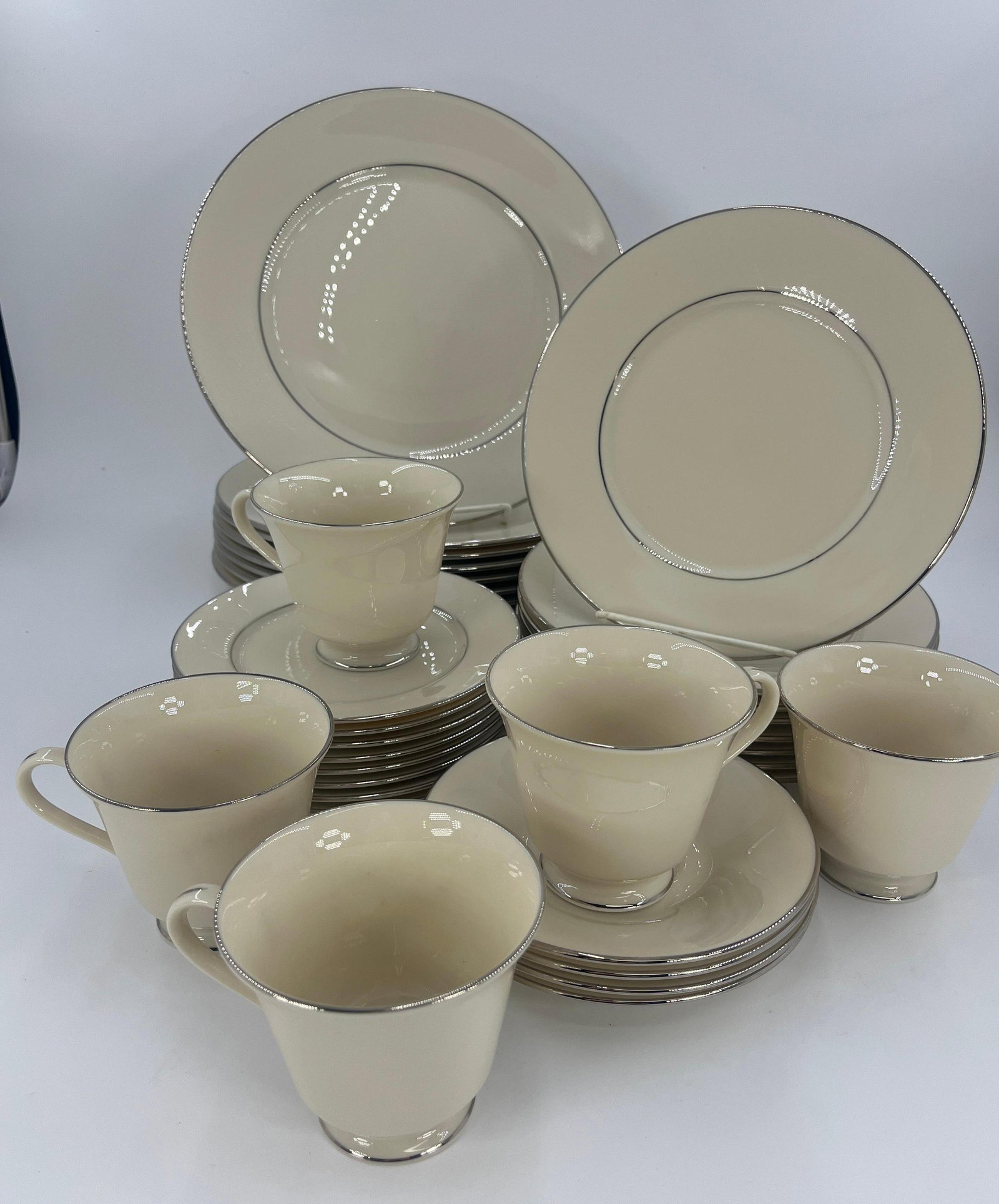 Lenox Montclair Servingware Set, INV. 1119: Includes 8 large plates, 8 medium plates, 8 small plates, 4 saucers, 5 cups. Approx. dia. of large plate 10 3/4". With marking.