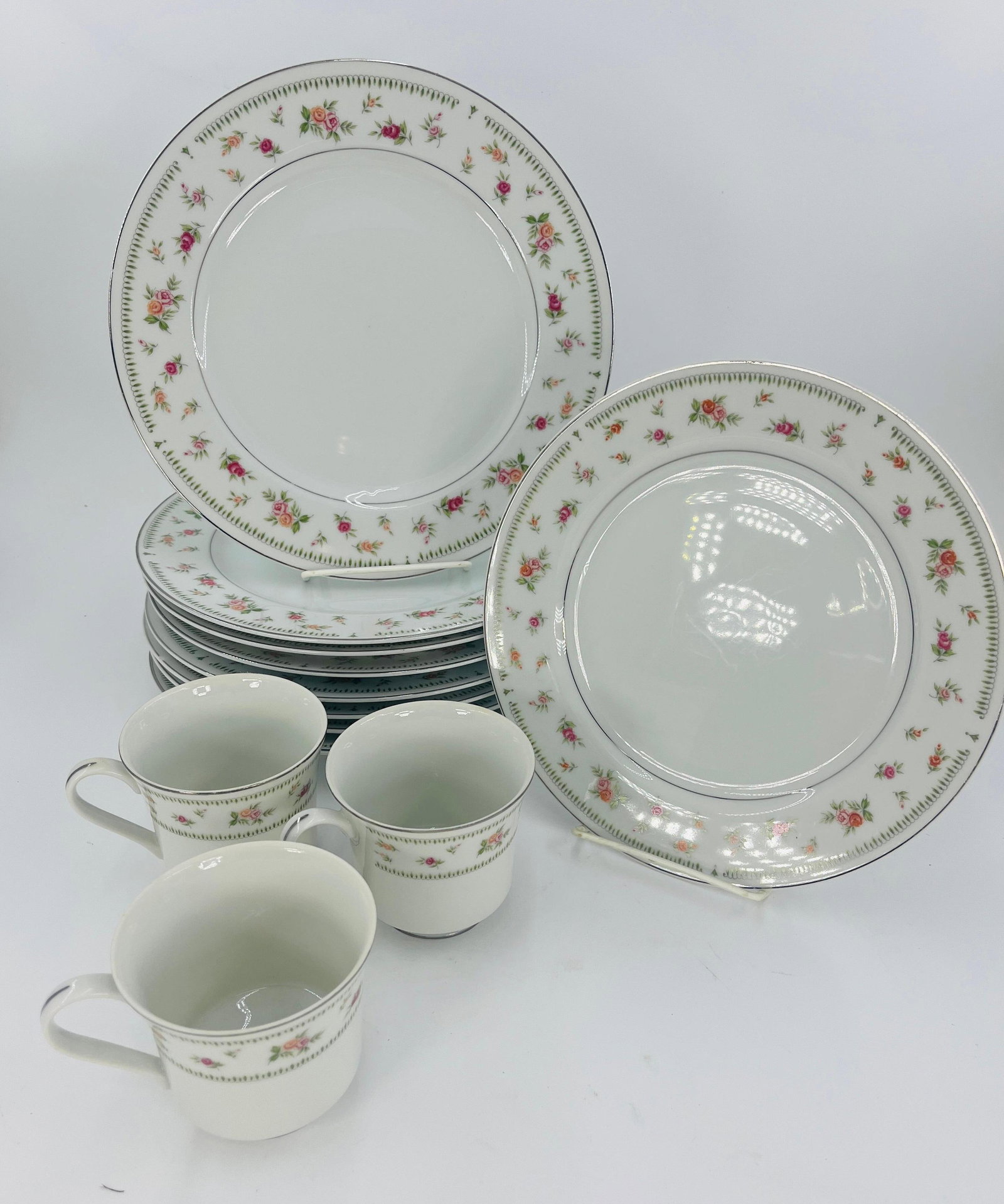 Abingdon Japan Floral Servingware, INV. 1125: Includes 8 large plates, 1 medium plate, 3 cups. Approx. dia. of large plate 10 1/8". With marking.