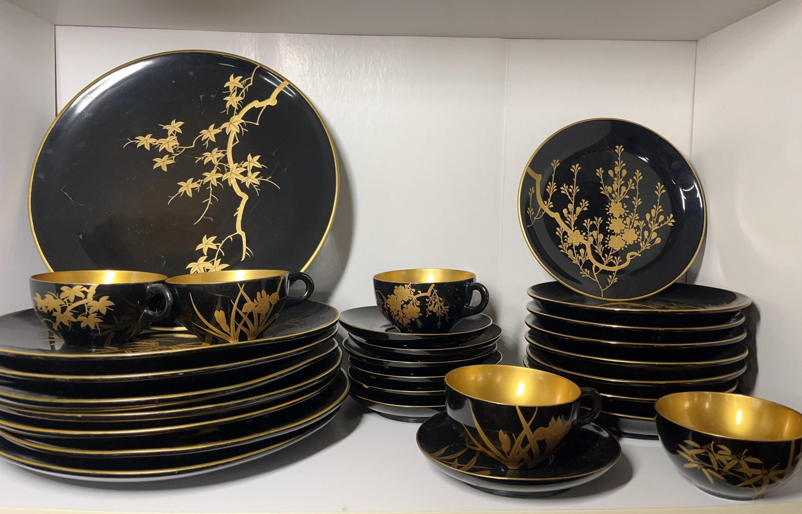 Japanese Maki-e Lacquered Set, Vintage, 28 pieces, INV. 1237: Floral design. Largest plate dia. 10 1/4".