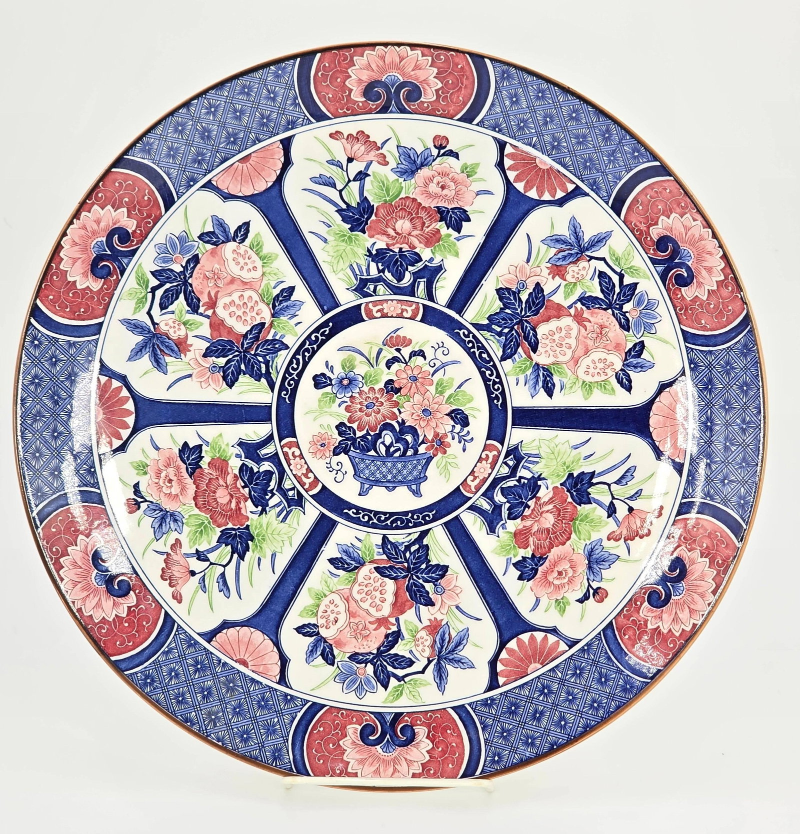 Vintage Japanese Imari Style Porcelain Plate, INV. 219: Floral and vase pattern design in cobalt blue and iron red. Diameter 12.75 inches.