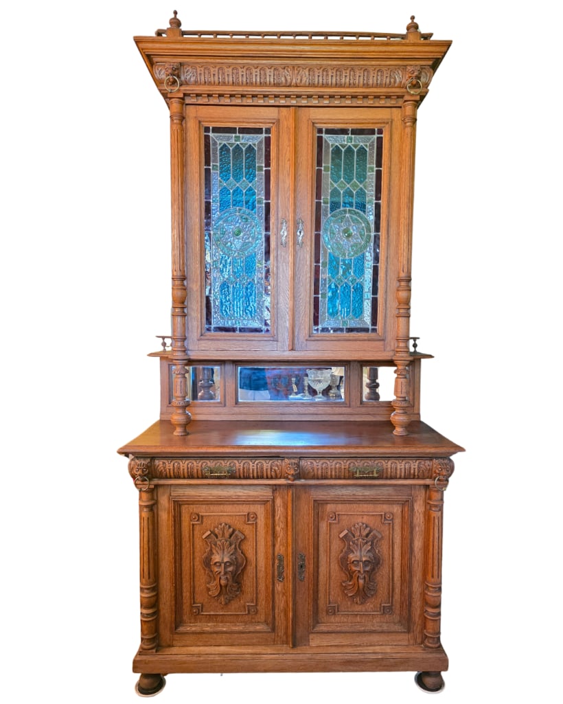 Incredible Renaissance Revival Mechelen Oak Hunt Cabinet, INV. 241: With stained glass, carved lions heads, carved greenman motifs, 2-doors on top, with 2-drawers and 2-doors below.? Approx. 106.5 x 52 x 23.5?inches