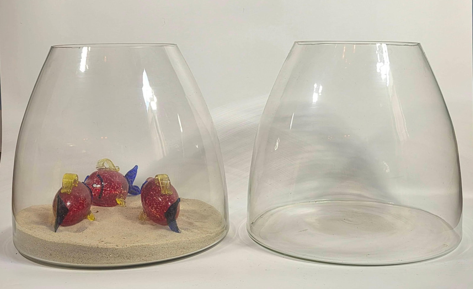 Pair of Oversized Glass Vases, INV. 2006: Including sand and glass fish. Each vase approx. 16 x 17.5 x 17.5 inches