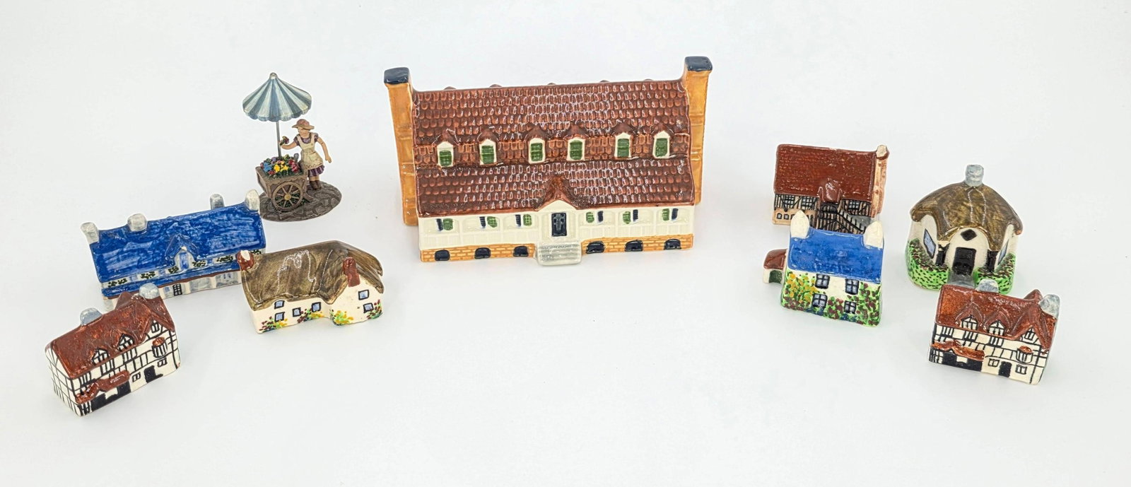 Assorted Village Figurines, mostly made in England incl. 1 Delft Holland, INV. 441, 442, 807: With marking. Largest piece 2.5 x 4.75 x 3 inches