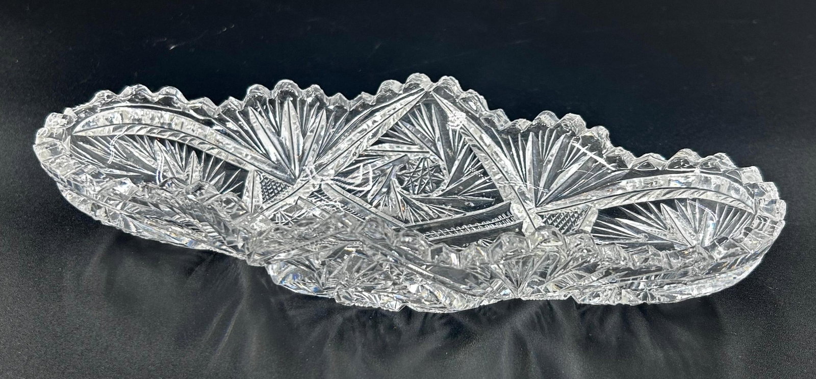American Brilliant Period cut glass celery dish. inv 508: Approx. 1.625 x 8.625 x 4 inches.