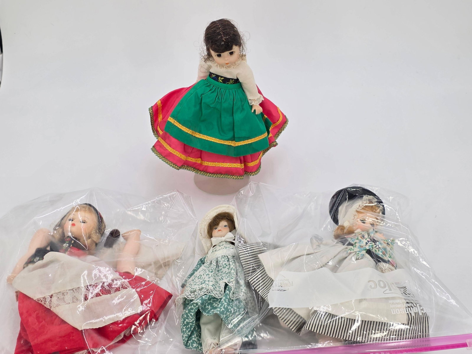 3 Madam Alexander Dolls, and 1 Additional Doll, INV. 313,314,312,311: Italy, Sweden, Great Britain Madam Alexander Dolls. Italy approx. 9 inches