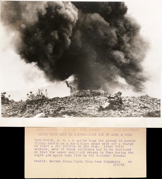 W. Eugene Smith: Name: W. Eugene Smith Title: Doing This Once is Enough - They Did It Over and Over Date: c. 1945 Process: silver print, newspaper caption attached to print verso Size: 7"x9"